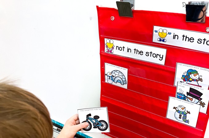Students sorting retelling cards for snowmen at night